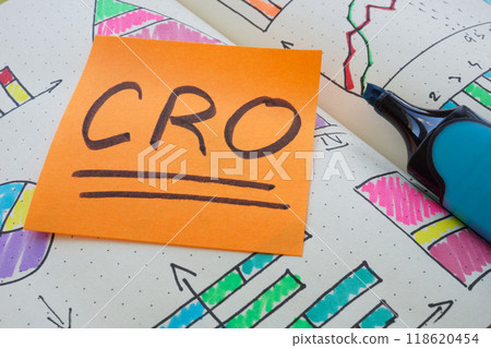 CRO Conversion Rate Optimization note in an open notebook. CRO Conversion Rate Optimization note in an open notebook. 118620454