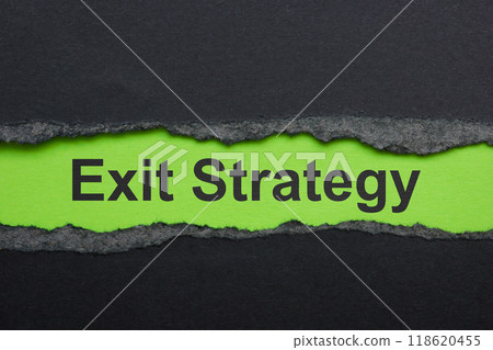 Torn paper with the words exit strategy. Represents business closure. Torn paper with the words exit strategy. Represents business closure. 118620455