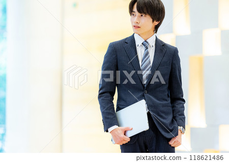 Businessman with a laptop, photo courtesy of Denpa Gakuen, Tokyo Electronics College 118621486
