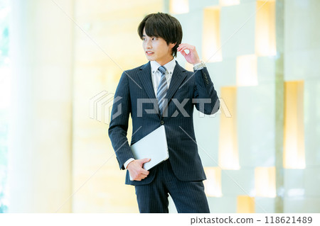 Businessman with a laptop, photo courtesy of Denpa Gakuen, Tokyo Electronics College Businessman with a laptop, photo courtesy of Denpa Gakuen, Tokyo Electronics College 118621489