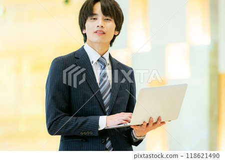 Businessman with a laptop, photo courtesy of Denpa Gakuen, Tokyo Electronics College Businessman with a laptop, photo courtesy of Denpa Gakuen, Tokyo Electronics College 118621490