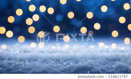 Falling snow with golden bokeh lights on a dark blue background. Winter holiday and festive decoration concept with copy space 118621797
