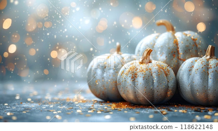 Thanksgiving and Harvest Festival. A group of silver metallic pumpkins on a black background with gold confetti in a flat lay. A web banner with copy space on the right. 118622148