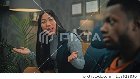 Multiethnic young family having conflict during consultation with psychotherapist 118622830