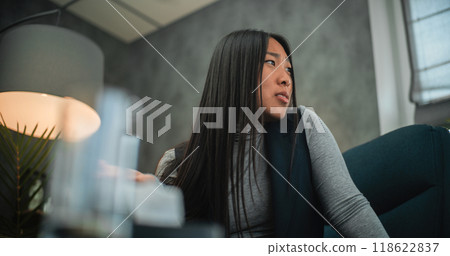 Angry and aggressive Asian woman loses temper, shouts during couples therapy session 118622837