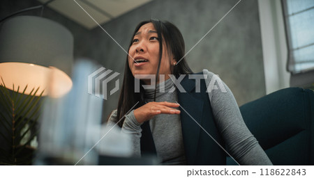 Angry and aggressive Asian woman loses temper, shouts during couples therapy session Angry and aggressive Asian woman loses temper, shouts during couples therapy session 118622843