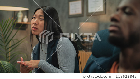 Multiethnic young couple on counseling session with psychologist Multiethnic young couple on counseling session with psychologist 118622845