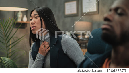 Close up of Asian young woman and African American man talking about relationship conflict 118622875
