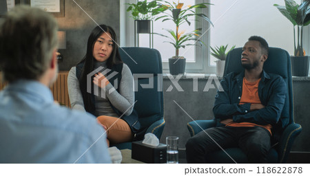 Asian woman talks about relationship. Multiethnic family on counseling session Asian woman talks about relationship. Multiethnic family on counseling session 118622878