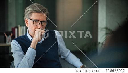 Mature psychologist analyzes problem, provides couples therapy Mature psychologist analyzes problem, provides couples therapy 118622922