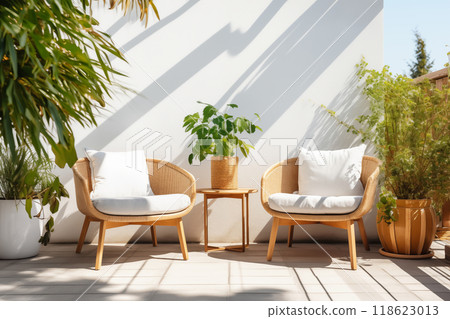 Cozy outdoor roof terrace or patio with armchairs and potted plants 118623013