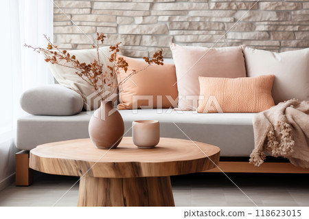 Minimal living room with wooden coffee table near sofa close-up. Interior in trendy peach colors 118623015