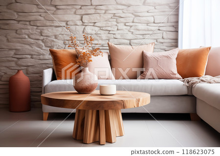 Minimal living room with wooden coffee table near sofa close-up. Interior in trendy peach colors 118623075