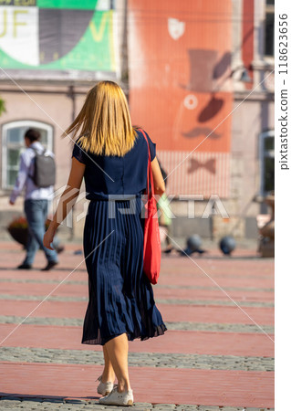 Woman walking on the street Woman walking on the street 118623656