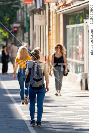 Woman walking on the street Woman walking on the street 118623665