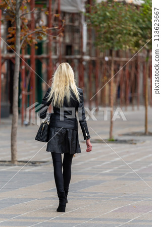 Woman walking on the street Woman walking on the street 118623667