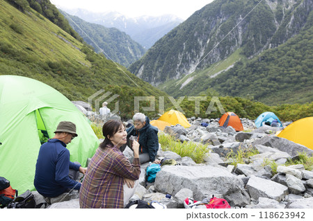 Climbers relaxing at a tent site Climbers relaxing at a tent site 118623942