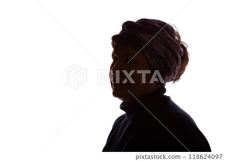 Dark silhouette of an elderly woman, pensioner in headdress - isolate Dark silhouette of an elderly woman, pensioner in headdress - isolate 118624097