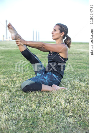 Woman looking through a red telescope at an outdoor observation deck... Woman looking through a red telescope at an outdoor observation deck... 118624782