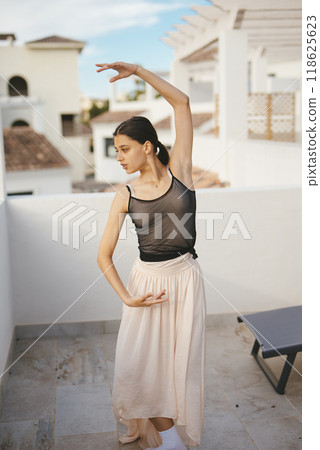 An Elegant Dance Pose Set Against a Beautiful Outdoor Setting in Natural Light and Grace 118625623