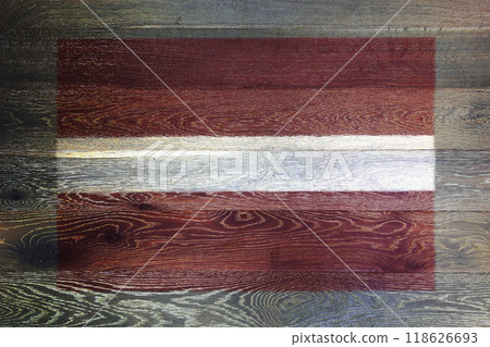 Latvia flag on rustic old wood surface background Latvia flag on rustic old wood surface background 118626693