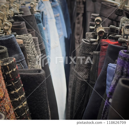 Sorting through reused clothing items in a sustainable fashion store Sorting through reused clothing items in a sustainable fashion store 118626709