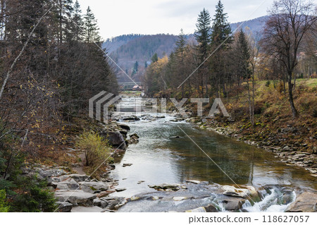 Mountain river with stones. Rafting river in forest. Splashy fast river texture. Natural water background 118627057