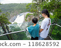 Siblings looking at the waterfalls in Barron River Gorge 118628592
