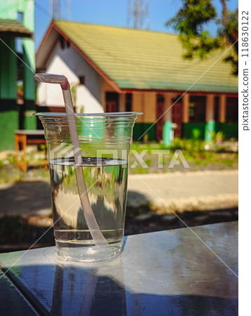 A cup of clear water in a transparent glass 118630122