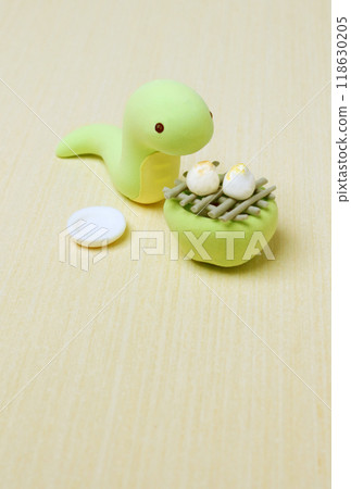 New Year's card 2025 of a snake roasting rice cakes, no text 118630205