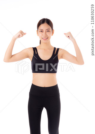 Portrait of beautiful young asian woman in sportswear showing strong muscles isolated. Portrait of beautiful young asian woman in sportswear showing strong muscles isolated. 118630259