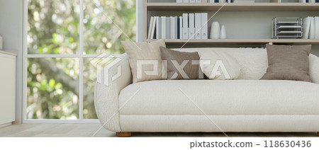 A close-up of a modern white sofa with pillows in a contemporary living room. 118630436