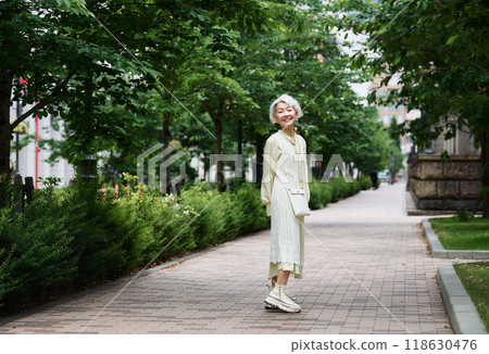 Cute senior woman going out 118630476