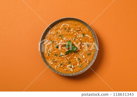 Sweet potato puree in bowl on orange background, top view Sweet potato puree in bowl on orange background, top view 118631343