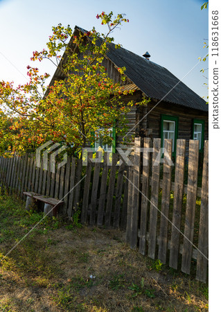 An old, rustic house in the evening in the village. Old Slavonic House 118631668