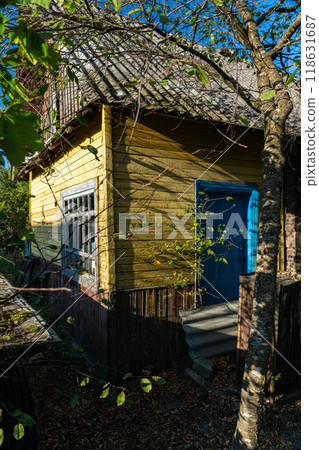 An old, rustic house in the evening in the village. Old Slavonic House 118631687
