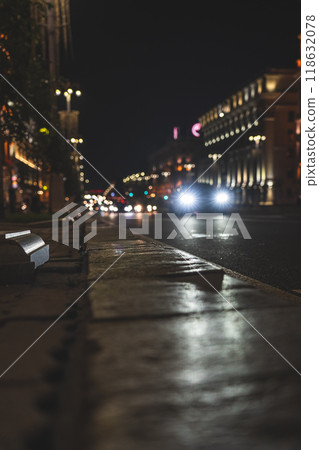 The night city of Minsk. Cars in the distance are driving along the avenue The night city of Minsk. Cars in the distance are driving along the avenue 118632078