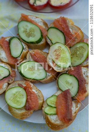Sandwiches with red fish and cucumber. Red fish and cucumber appetizer 118632091
