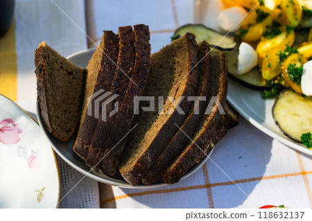 Sliced bread is in a saucer. Sliced bread Sliced bread is in a saucer. Sliced bread 118632137