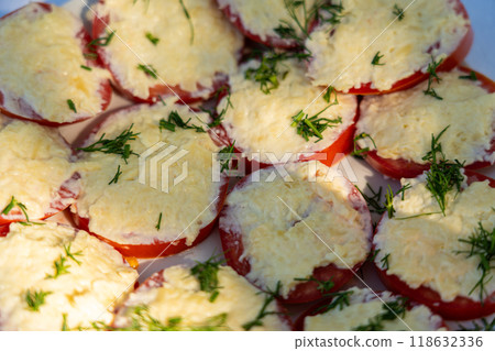 Tomatoes with cheese. Tomatoes sliced with cheese and sprinkled with dill on top Tomatoes with cheese. Tomatoes sliced with cheese and sprinkled with dill on top 118632336