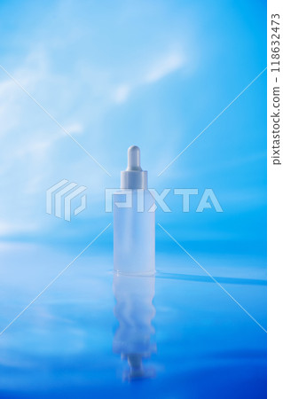 The commercial template for a skincare product has a minimalist picture design that highlights an unlabeled white serum container that stands alone against a vibrant blue sky. The commercial template for a skincare product has a minimalist picture design that highlights an unlabeled white serum container that stands alone against a vibrant blue sky. 118632473