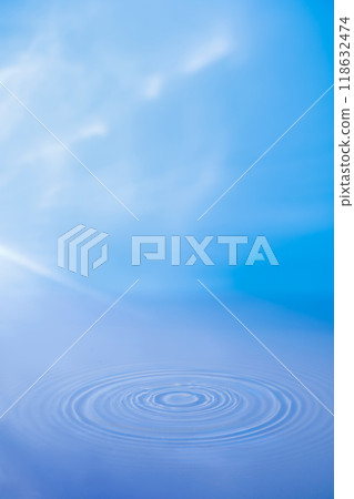 Under a clear blue sky, a serene minimalist composition features a vibrating lake that forms circles on the water. Product adverts are displayed in the empty space. Under a clear blue sky, a serene minimalist composition features a vibrating lake that forms circles on the water. Product adverts are displayed in the empty space. 118632474