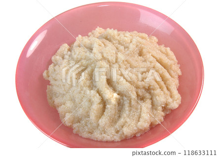 groats in plate on white 118633111