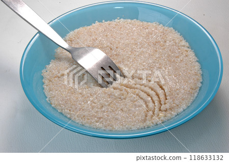 groats in plate on white groats in plate on white 118633132