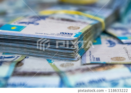 Thick wad of money cash on table Thick wad of money cash on table 118633222