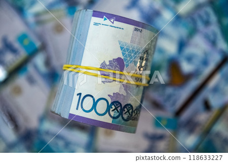 Thick wad of money cash on table Thick wad of money cash on table 118633227