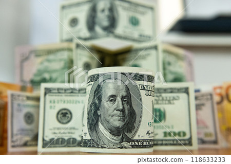 Thick wad of money cash on table Thick wad of money cash on table 118633233