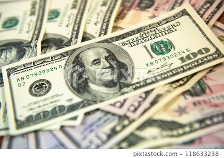 Thick wad of money cash on table Thick wad of money cash on table 118633238