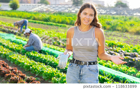 Young woman posing in field among harvest Young woman posing in field among harvest 118633899