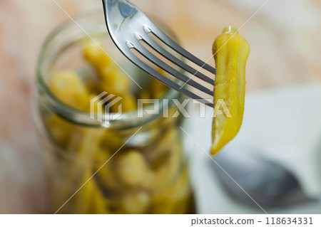 Homemade organic marinated pickled okra 118634331